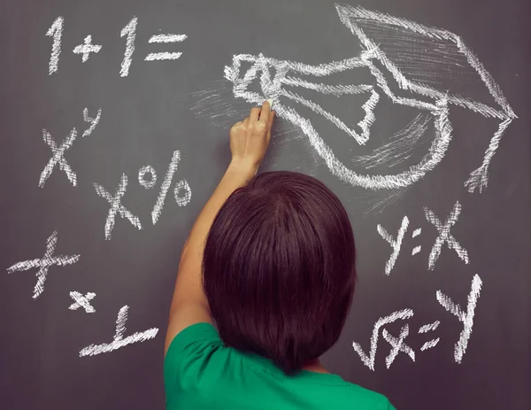 Woman is drawing lightbulb — Stock Photo, Image