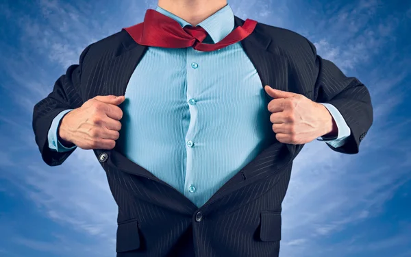 Businessman opens jacket showing his shirt — Stock Photo, Image