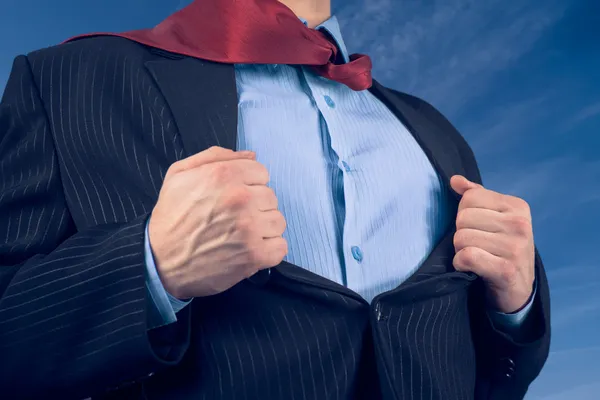 Businessman opens suit showing his shirt — Stock Photo, Image