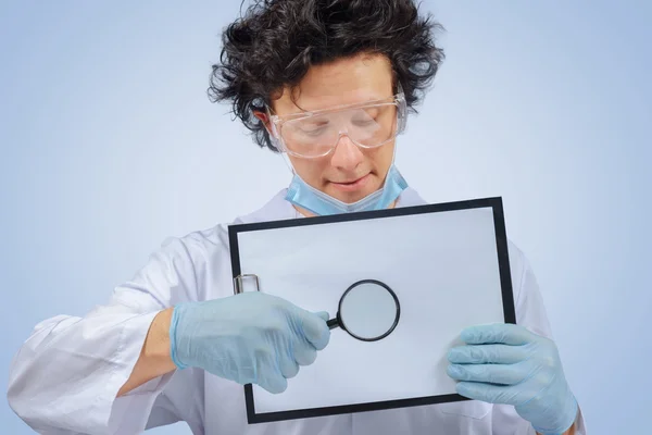 Funny doctor with clipboard — Stock Photo, Image