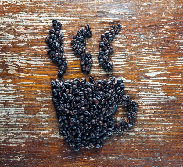 Coffee beans in the shape of cup — Stock Photo, Image