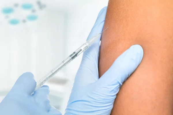 Vaccine in shoulder — Stock Photo, Image