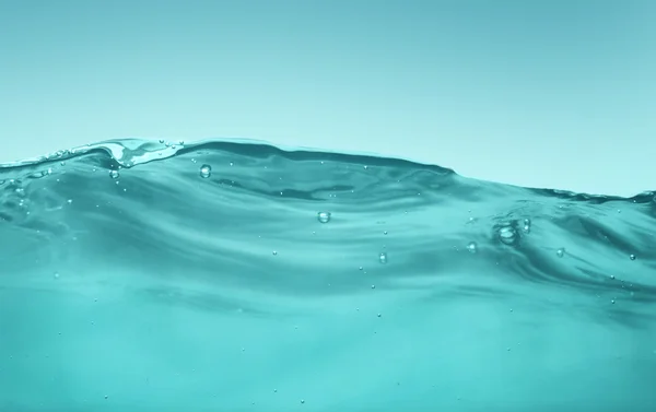 Turquoise water golven — Stockfoto