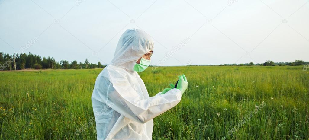 Biotechnology scientist on summer field