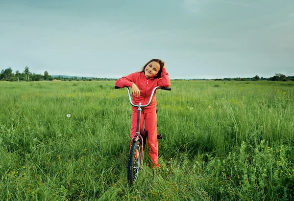 Little girl on a bicycle — Stock Photo, Image