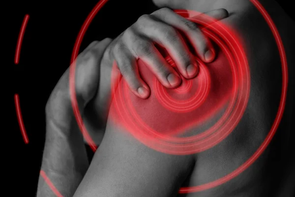 Pain in shoulder, close-up, pain area of red color — Stock Photo, Image