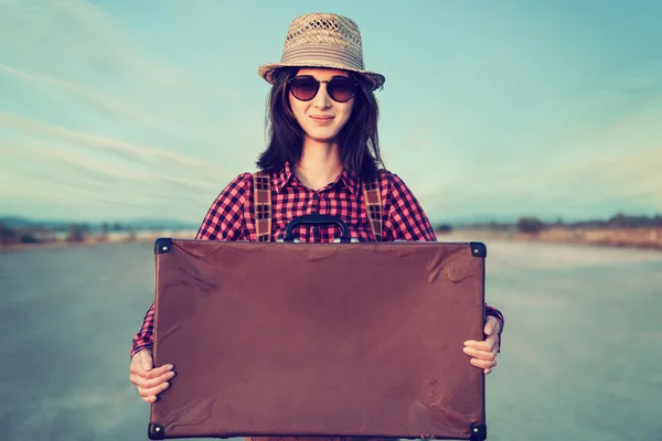 Hipster traveler with suitcase — Stock Photo, Image