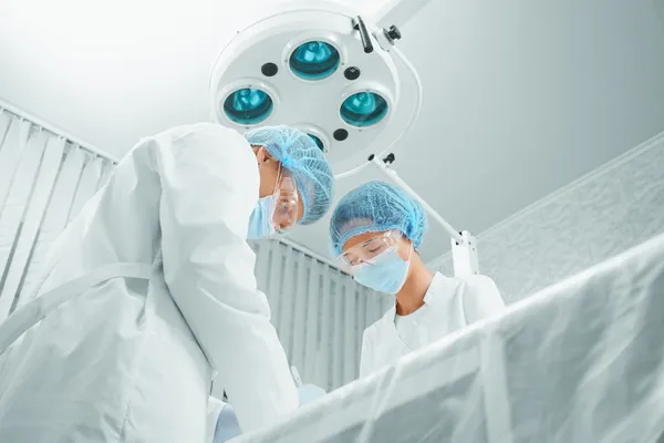 Teamwork surgeons on operation — Stock Photo, Image