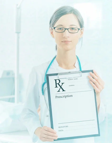 Woman doctor shows prescription paper — Stock Photo, Image