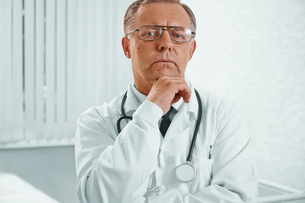 Pensive senior doctor — Stock Photo, Image