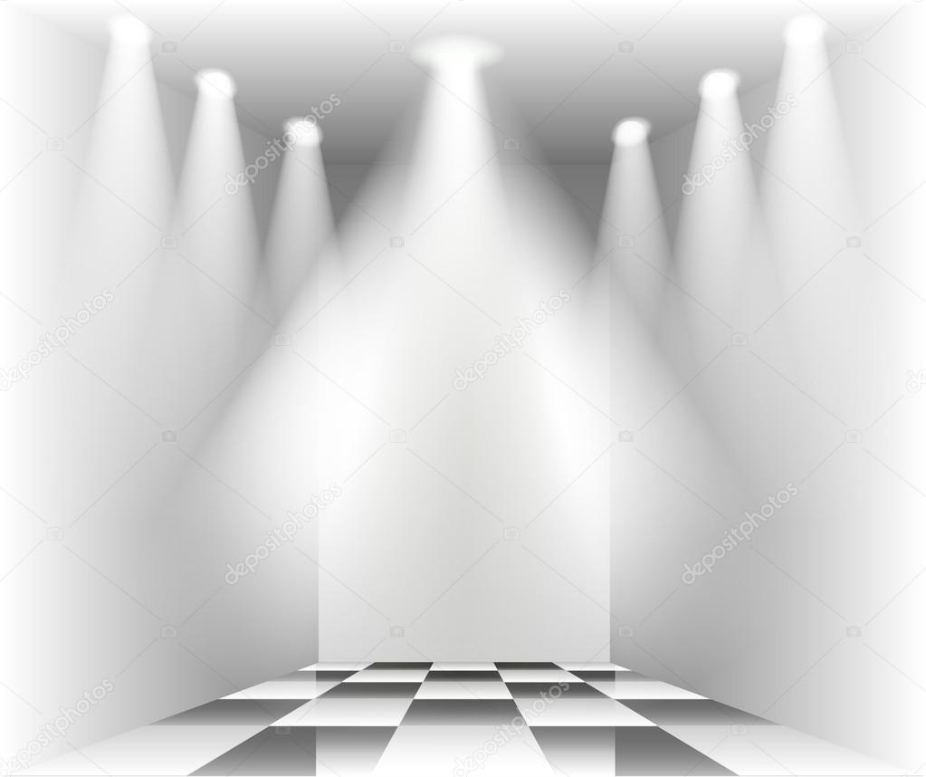 Illuminated empty room with a floor with a checkerboard pattern