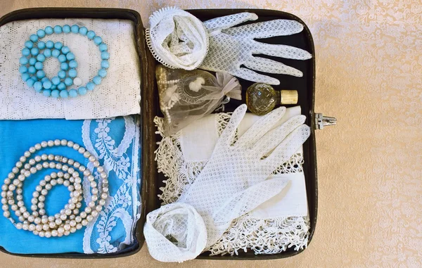 Small vintage suitcase with women's accessories — Stock Photo, Image