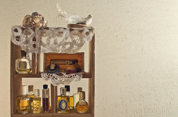 Shelf on the wall with women's perfume — Stock Photo, Image