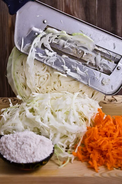 Cutting and salting cabbage — Stock Photo, Image