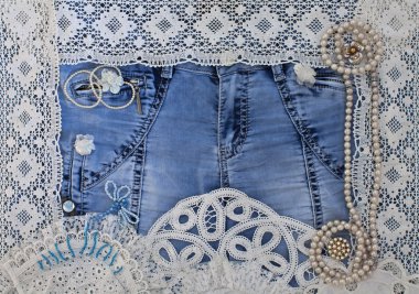 Denim background with lace and women's jewelry clipart