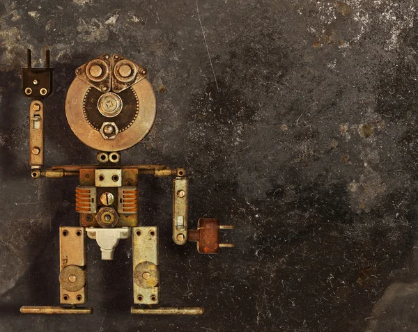 暗い汚れた背景に金属部品のロボット — ストック写真