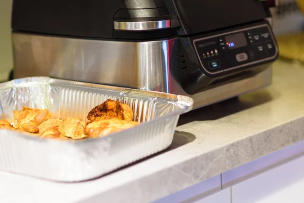 Cooking meat with spices in an air fryer. — Stock Photo, Image