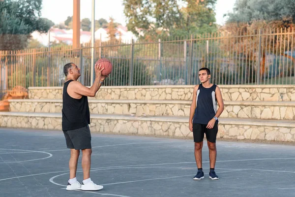 Basketball Trainer Holding A Ball. Happy Teen Playing With Senior Grandfather. — Stock Photo, Image