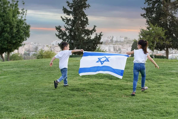 Young Children Running Israeli Flag Rear View Little Girl Boy Stockbild