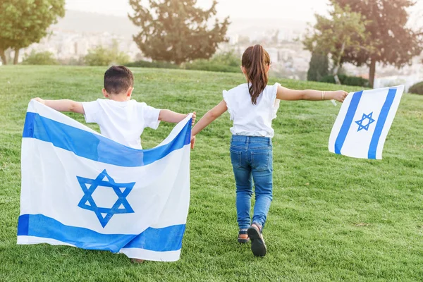 Young Children Running Israeli Flag Rear View Faceless Little Girl — стокове фото