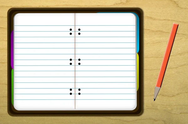 Kırmızı kalem ile ahşap masa üstünde defter