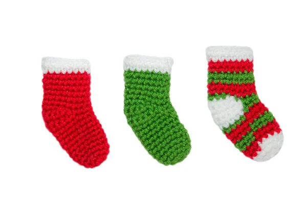 Green and red christmas sock ornaments on isolated white backgro — Stock Photo, Image