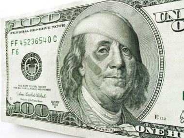 Ben Franklin with black eye and bandages on one hundred dollar bill illustrates many economic concepts and ideas. clipart