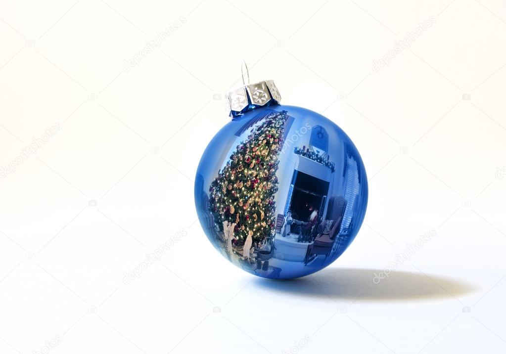 Shiny Blue Holiday Ornament Reflects Brightly Lit Colorful Christmas Tree