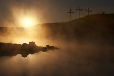 Three Crosses at Sunrise over a Foggy Lake Easter Morning