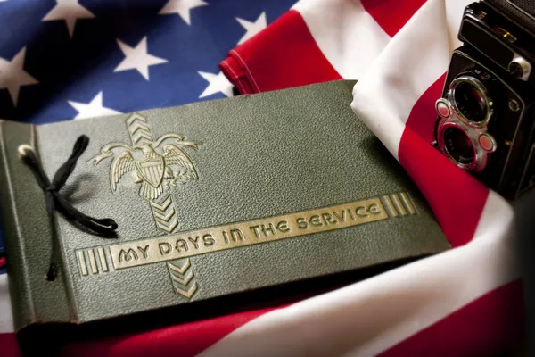 Memorial Day Veteran's Remembrance with Military Service album and flag. — Stock Photo, Image