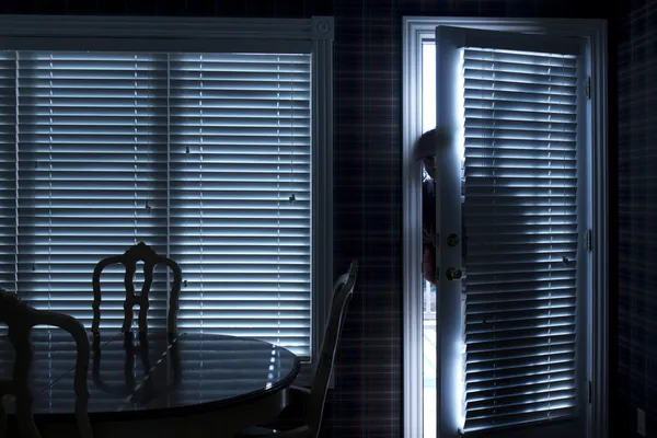 Burglar Breaking In To Home At Night Through Back Door — Stock Photo, Image