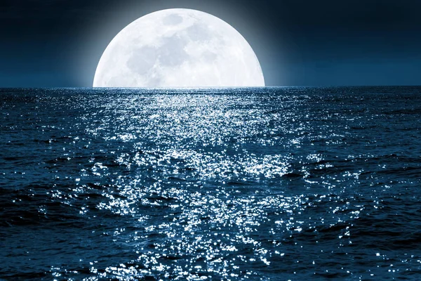 Bery Large Full Blue Moon Rises Calm Ocean Scene 스톡 사진