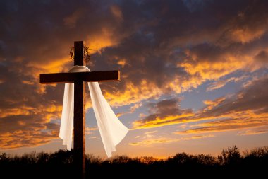 This dramatic sunrise lighting and Easter Cross makes a great Easter photo illustration of Jesus dying on the cross and rising again.