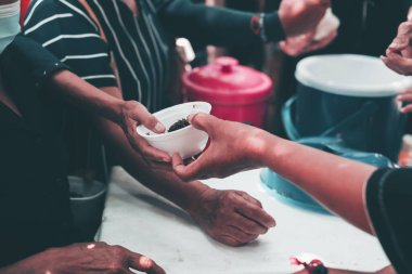 Charity food distribution to hungry and starving people: the concept of food sharing.