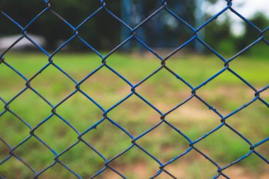 Chain link fence with blurred background : demarcation concept