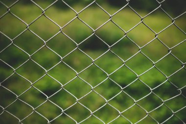 Chain link fence with blurred background : demarcation concept