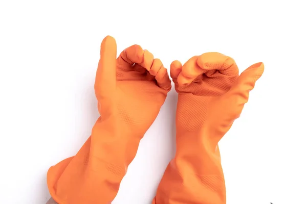 白い背景に隔離されたオレンジ色のゴム手袋 — ストック写真