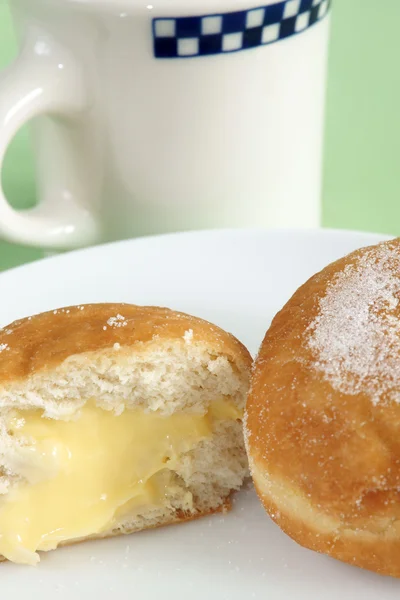 Custard filled donuts and coffee — Stock Photo, Image