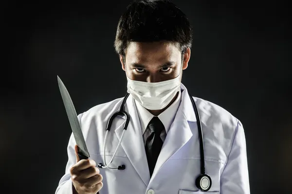 Dottor Serial Killer psicosi tenere coltello Fotografia Stock