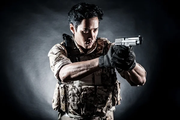 Soldier man hold gun fashion Stock Picture