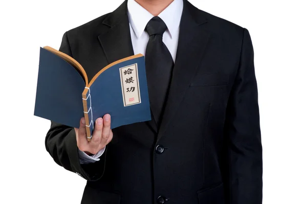 Business man hold kungfu book in isolated — Stock Photo, Image