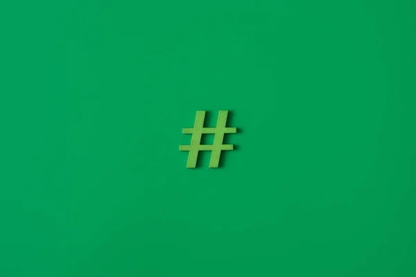 Green Wooden Symbol Hashtag Green Background Copy Space Social Media — Stock Photo, Image