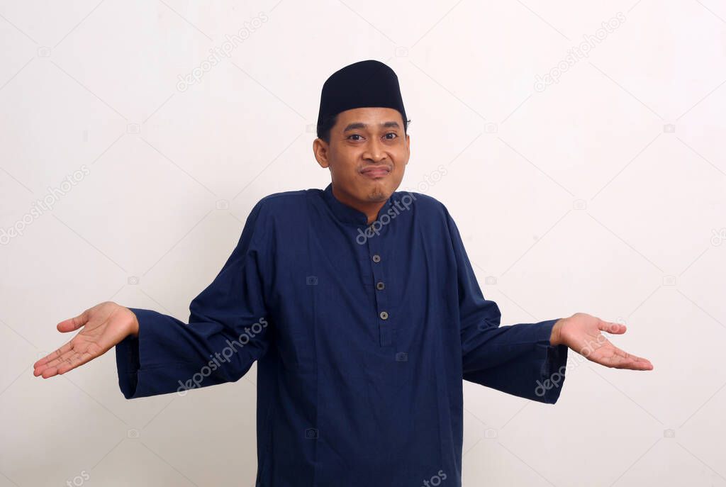 Asian man with dont know gesture. Isolated on white