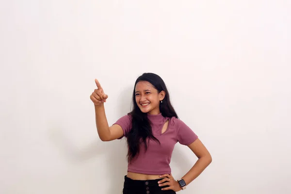 Asian Girl Stands Smiling Shows Empty Space Her Isolated White — 스톡 사진
