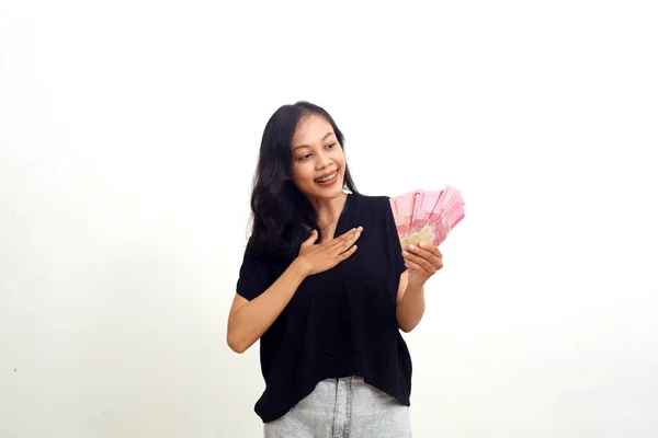 Asian Young Woman Feels Relieved Happy While Holding Indonesian Money — Stockfoto