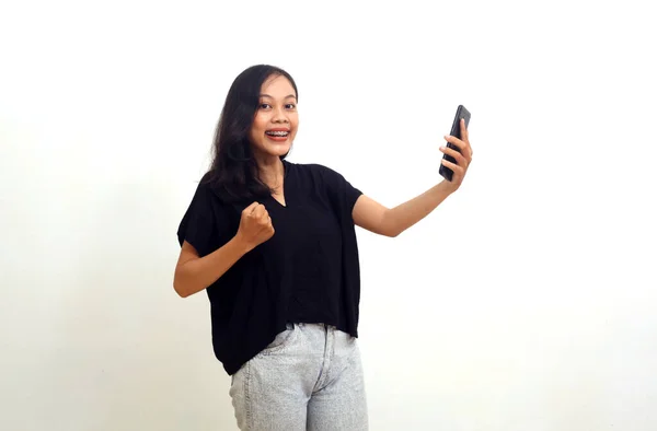 Joyful Asian Young Woman Standing While Holding Cellular Phone Good — Stock Photo, Image
