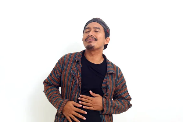 Asian Man Standing While Touching His Stomach Fells Full Satisfied — Fotografia de Stock