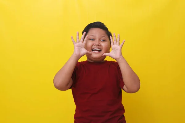 Cheerful Asian Boy Standing While Showing Funny Expression Isolated Yellow — Foto de Stock