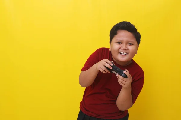 Fun Asian Boy Standing While Holding Joystick Gaming Concept Isolated — ストック写真