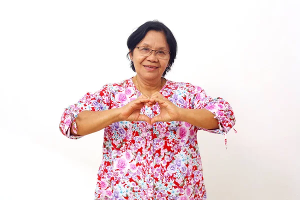 Asian Elderly Woman Standing While Showing Love Hand Shape Gesture — ストック写真